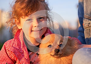 Large portrait of adorable little girl with doggie