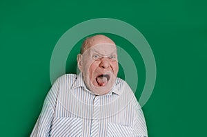 a large portrait of a crazy old man on an isolated green background. chromakey