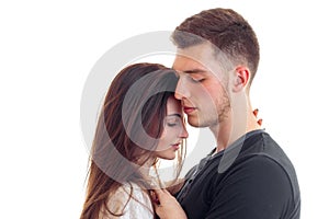 A large portrait of young couple couples cuddling