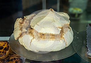 Large portuguese meringues known as Suspiros in bakery photo