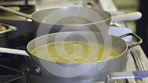 Large pot of soup on a commercial stove