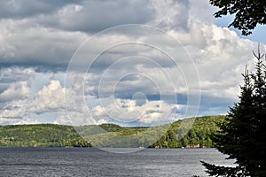 Large Puffy Clouds Over A Lake in Ontario`s Cottage Country