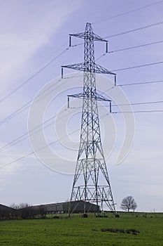 A large pylon and cables carrying electricity generated at Ballylumford Power Stationy into the grid