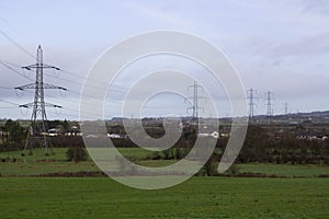 Large pylons and cables carrying electricity generated at Ballylumford Power Stationy into the grid