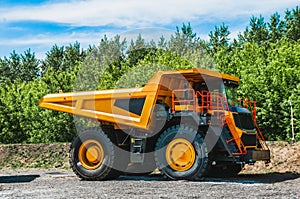 A large quarry dump truck in a coal mine. Mining equipment for the transportation of minerals