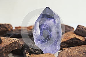 Large quartz crystal on white background close-up