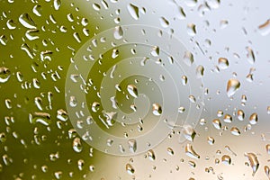 Large raindrops on the windshield of car. Inside view. Selective photo