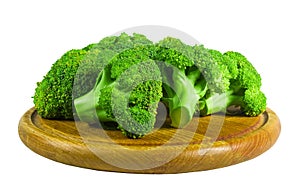 Large raw fresh head of broccoli cabbage on a wooden board, white background, healthy vegetarian food, isolated, close-up
