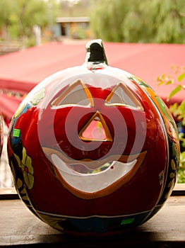 Large red ceramic pumpkin on a market in Old Town