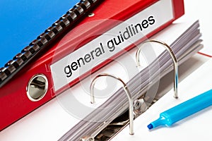 Large red folder for general guidelines including blue ring binder and blue maker