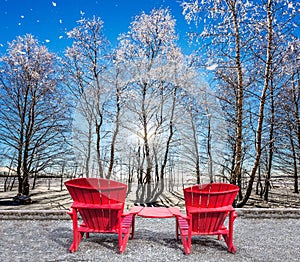 Large red plastic chaise lounges