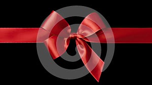 A large red ribbon bow on the left of a long straight piece of ribbon and a vertical piece to be used as a border for a birthday