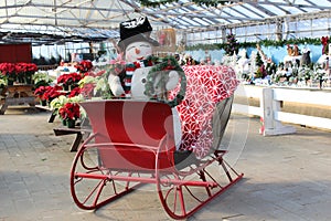 Large red sleigh with snowman at holiday event, Sunnyside Gardens, Saratoga New York, 2019