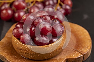 large red wet grapes in drops of water