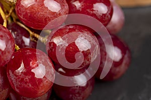 large red wet grapes in drops of water