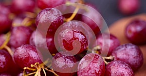 large red wet grapes in drops of water