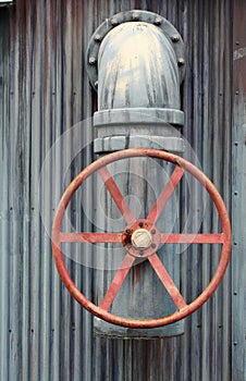 Large red wheel valve with pipe