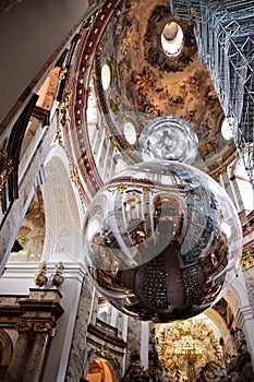 Large, reflective spheres inside the beautiful church of San Carlo Borromeo in Vienna. In addition to the spheres, the frescoed in