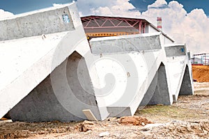 Large reinforced concrete structures at the construction site. Preparation for the installation of reinforced concrete products.