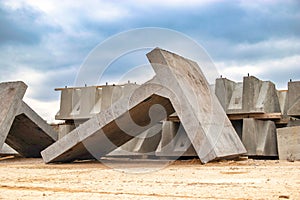 Large reinforced concrete structures at the construction site. Preparation for the installation of reinforced concrete products.