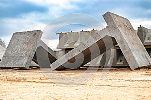 Large reinforced concrete structures at the construction site. Preparation for the installation of reinforced concrete products.