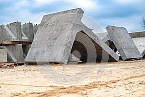 Large reinforced concrete structures at the construction site. Preparation for the installation of reinforced concrete products.