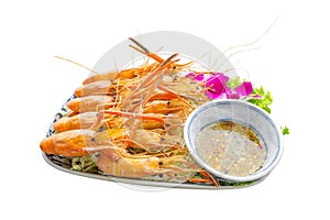 Large river prawns on a plate with vegetables and seafood sauce on white background, isolated and clipping path