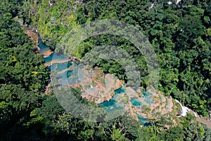 Large river and Semuc Champey natural monument in Guatemala, aerial, vertical