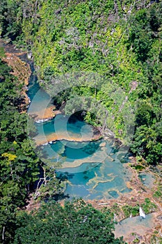 Large river and Semuc Champey natural monument in Guatemala, aerial, vertical