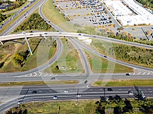 Large road interchange and parking lot in Leesburg, Virginia. View from a drone on a sunny day