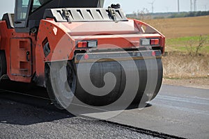 Large road-roller paving a road