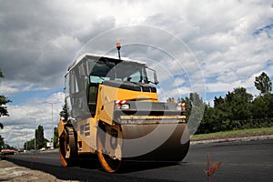 Large road-roller paving a road