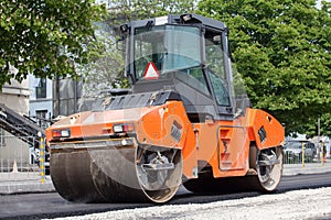 Large road-roller paving a road
