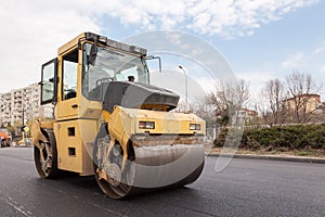 Large road-roller paving a road. Road construction