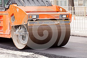 Large road-roller paving a road. Road construction