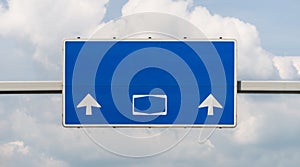 A large road sign above a German highway in blue, with no signs and subtitles, with a clipping path.
