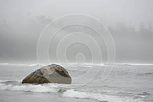 Large rock with crashing surf, Florencia Beach, Pacific Rim National Park photo