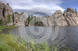 Large rock pillars by the lake.