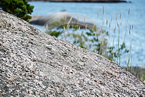 Large rock with sea on background