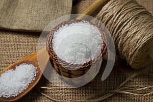 Large rock sea salt on a brown background.