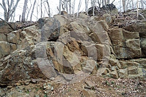 The large rocks on the side of the trail.