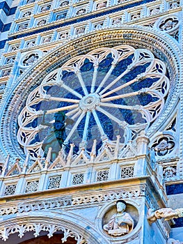 The large Rose Window on facade of Monza Duomo, Italy photo