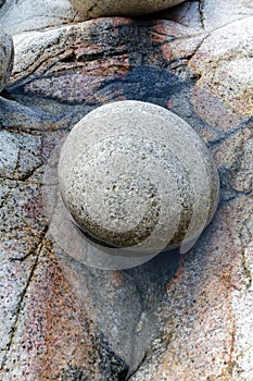 Large round pebble in rock pool