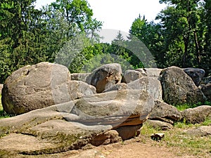 Large round stones lie on the ground. Sofiyivka park in the Uman city. Ukraine. Nature in summer