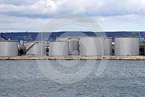 large round storage tanks in the cargo sea port of Varna Bulgaria