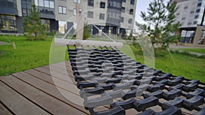 Large rubber hammock stands in courtyard of apartment block