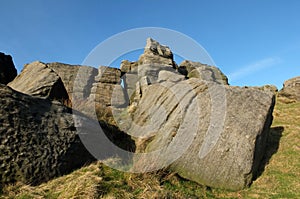 large rugged gritstone outcrop at the bridestones a large rock formation in west yorkshire near todmordenwith blue sky and