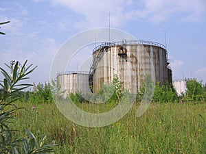 Large, rusty, bunkers storage tanks for fuel and gasoline strategic aviation fuel stock