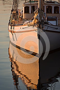 Large sailing vessel docked in morning light