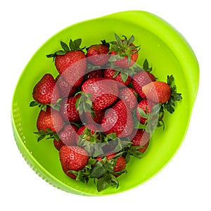 Large salad bowl full of red fresh strawberries isolated on white background. Top view, flat lay.